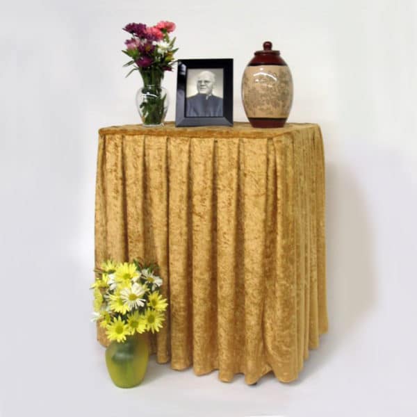 display table shown with gold drape